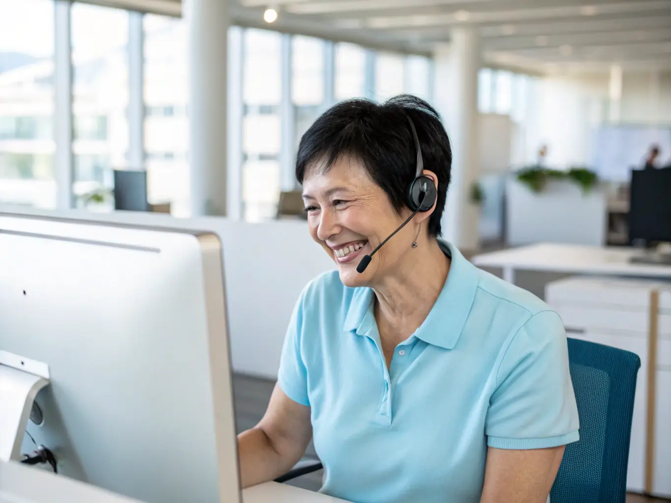 A photograph of a customer service representative wearing a headset, smiling and assisting a customer on a computer screen, symbolizing the 24/7 customer support provided by H2777.